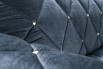 Detail of the tufted cover with nickel-plated buttons.