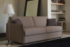 Stan model with thin curved armrests.