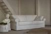 Classic fabric sofa with decorative ribbons.