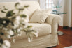 Detail of the sofa armrest with decorative ribbons.