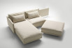 The lateral element rotate on a joint that connects it to the sofa central seat.