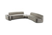 A large sofa made of two modules, one arm and a low pouffe