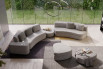 A custom design with one sofa and one sofa bed joined by a pouffe and completed with an arm