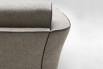 Detail of the backrest finished with a decorative piping