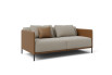 Side view of two-tone sofa bed with decorative cushion