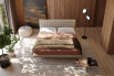Suspended double bed with Cocos single riser system