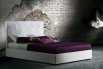 Mauritius bed with embroidered headboard with flower decoration