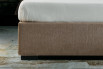 Detail of the slim bed ring and a wengé wooden foot