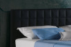 Detail of the quilted headboard with leather cover