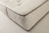 Detail of the quilting withe mbroideries and contrasting edges